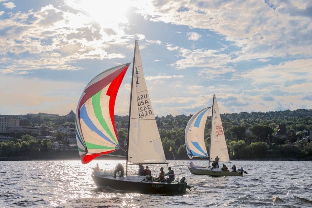 Two sailboats on the water